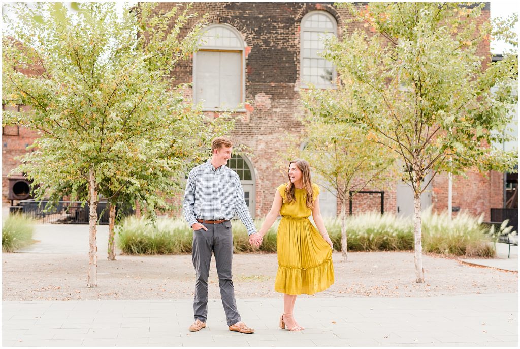 Engagement couple at historic tredegar ironworks entrance in richmond virginia